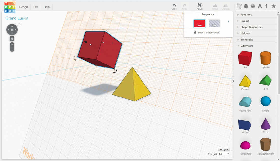 The red cube is added to the workplane along one of the sides of the yellow pyramid