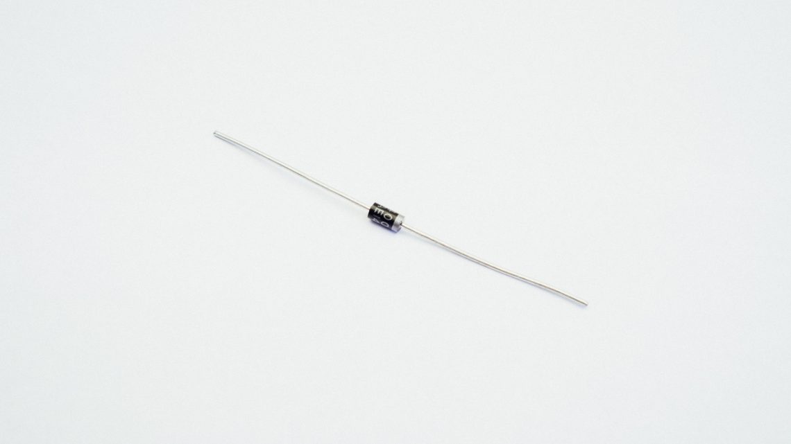 A bog standard 1N4001 diode (datasheet: https://cdn-shop.adafruit.com/datasheets/1N4001-D.PDF)